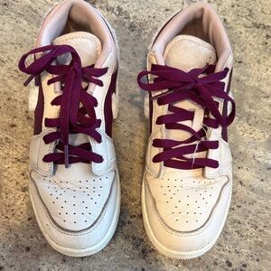 Girls low Jordan’s with furry Nike swoosh